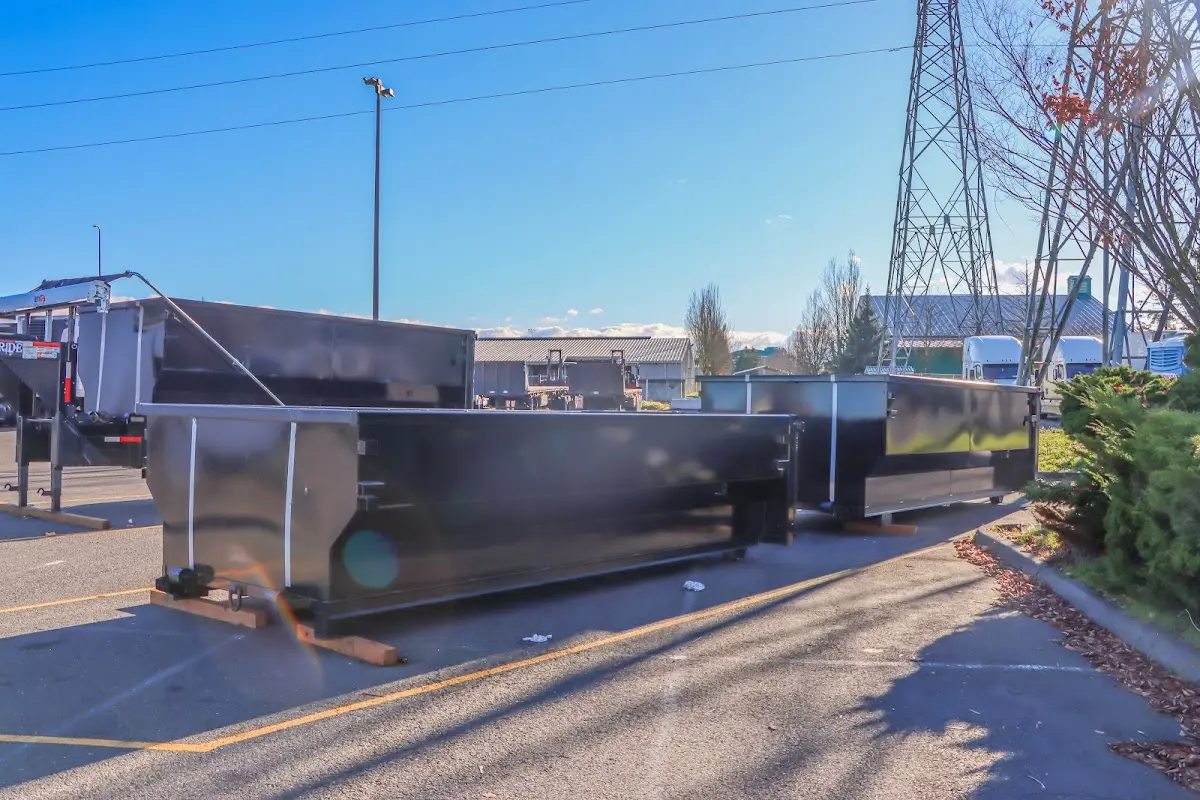 Roll-off dumpster ready for waste disposal at job site for Concrete Dumpster Rental in Oakleaf Plantation